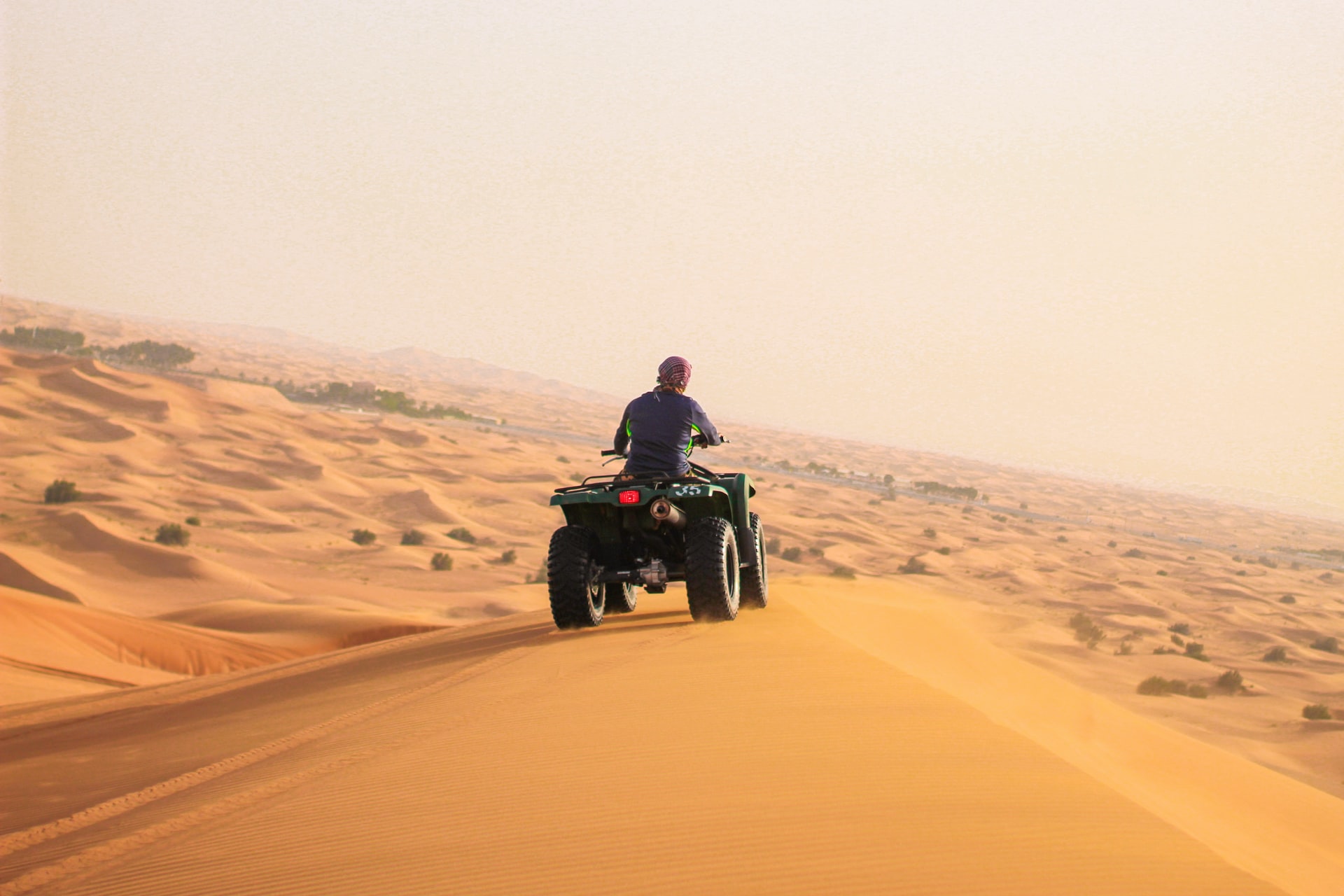 Wants to explore the Amazing dunes of Abu Dhabi Desert and enjoy the Abu Dhabi desert safari with quad bike?